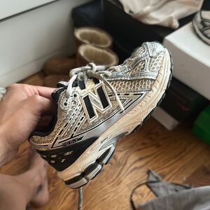 New Balance Silver and Black Sneakers